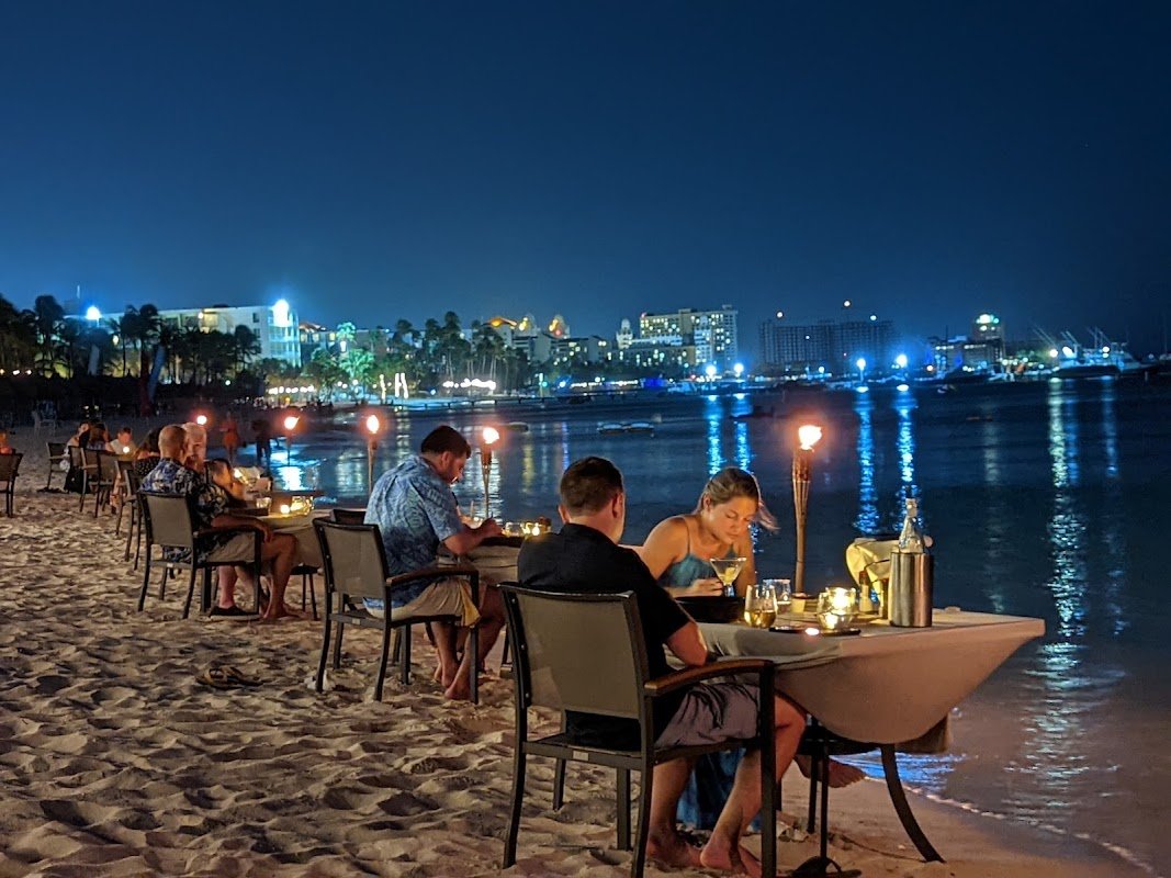 Atardi Restaurant Aruba beachfront dining at sunset on Palm Beach