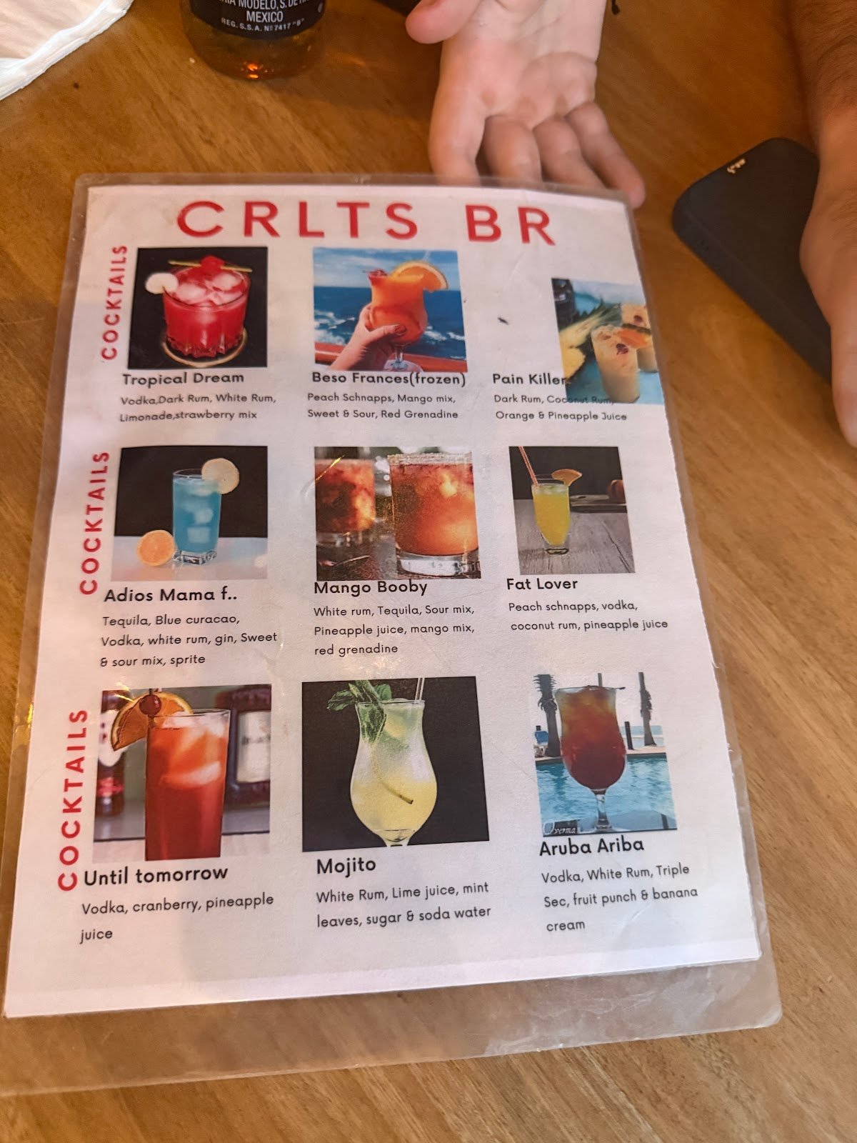 The cocktail card at Carlitos — Aruba Ariba, Pain Killer, Mojito and frozen house drinks, no printed prices