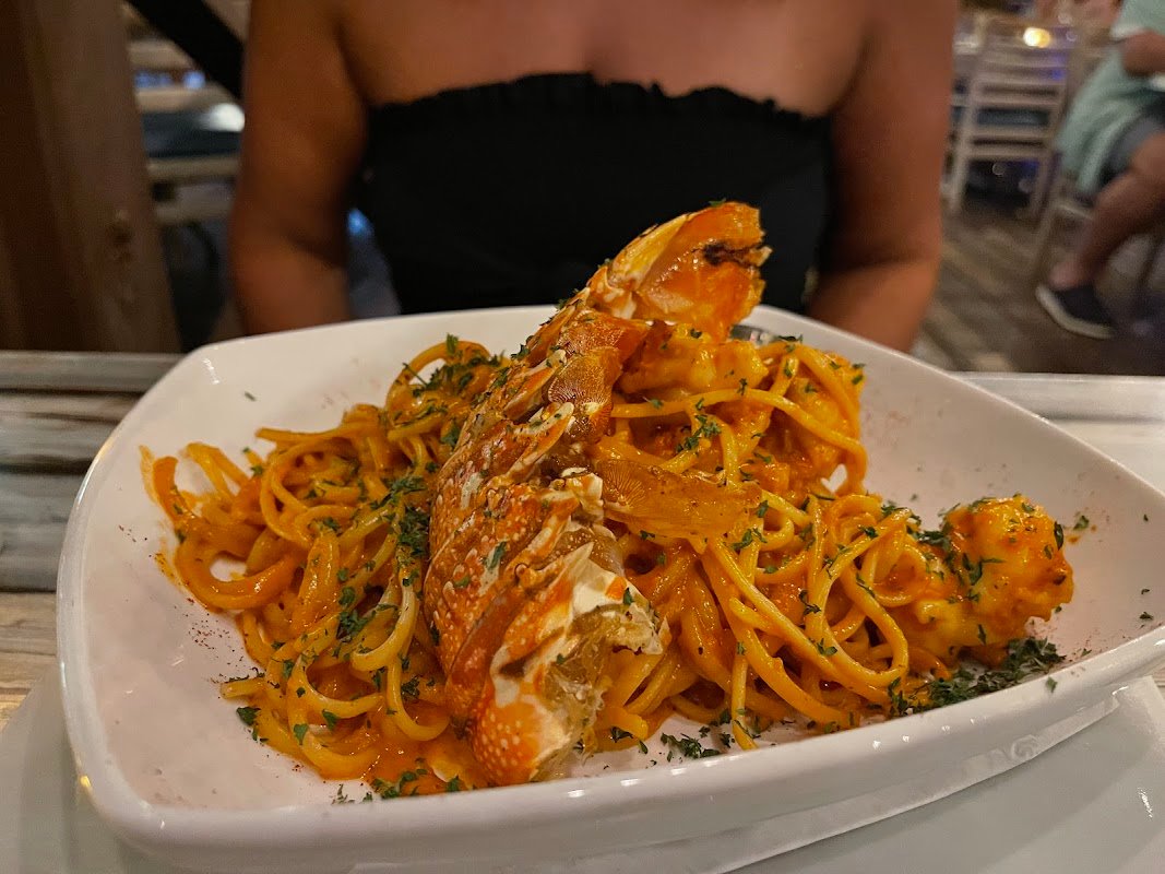 Ricardo's Aruba beachfront bar palapa tables Caribbean Sea