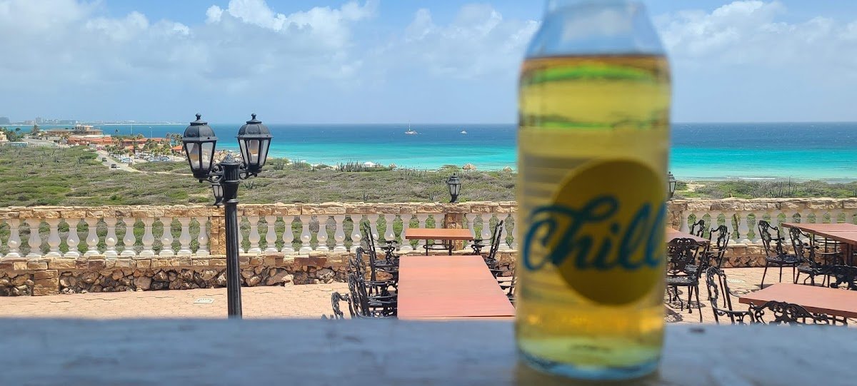 Faro Blanco Aruba terrace dining at California Lighthouse with sunset