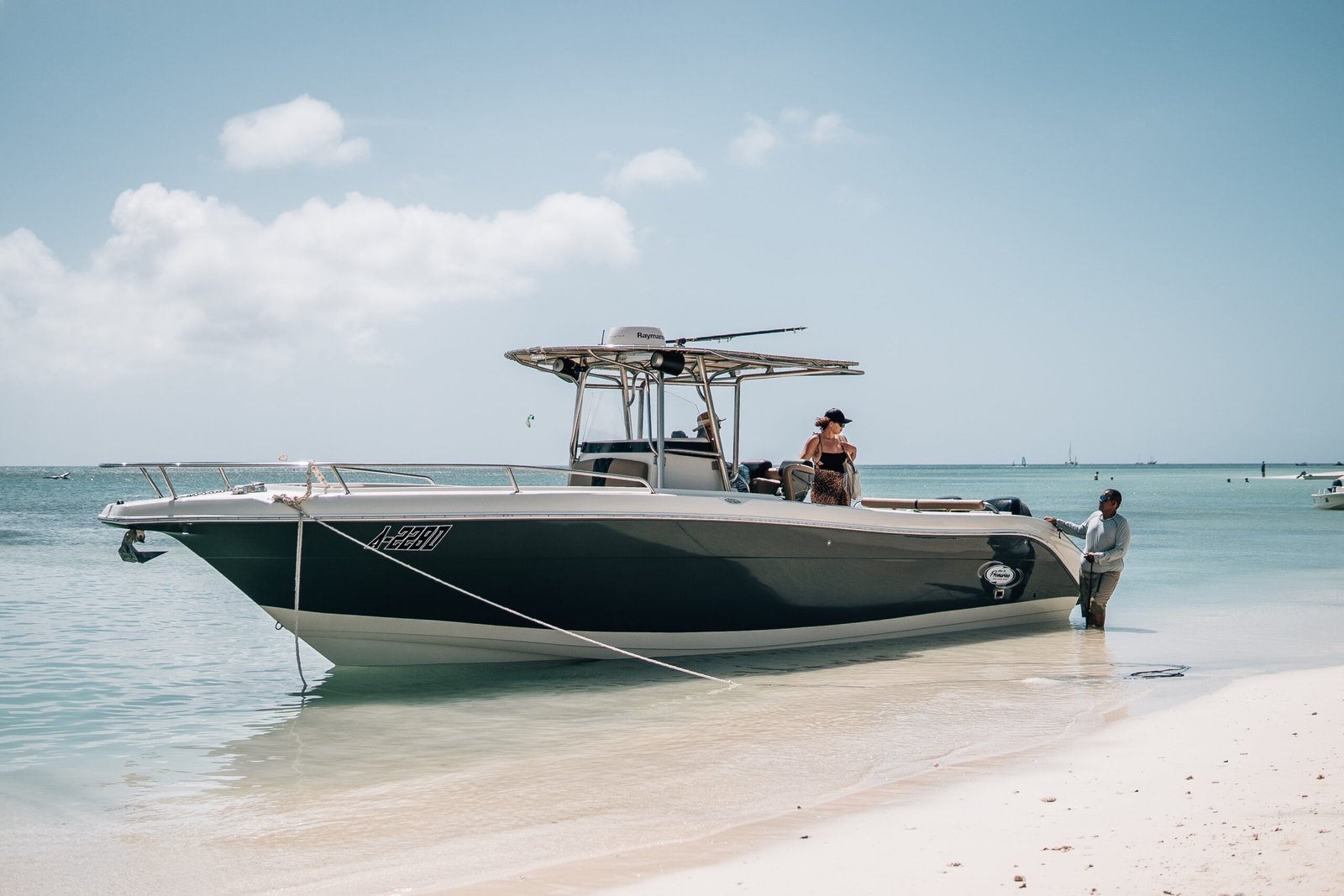 Private boat charter in Aruba anchored over clear turquoise water