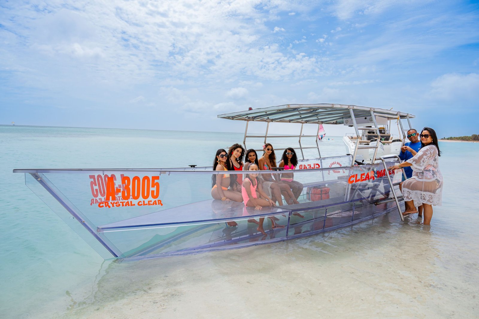 Guests swimming with sea turtles on a private boat charter in Aruba