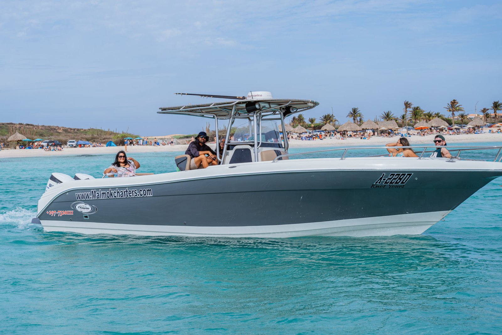 Malmok Charters boat cruising the west coast on a private boat charter in Aruba