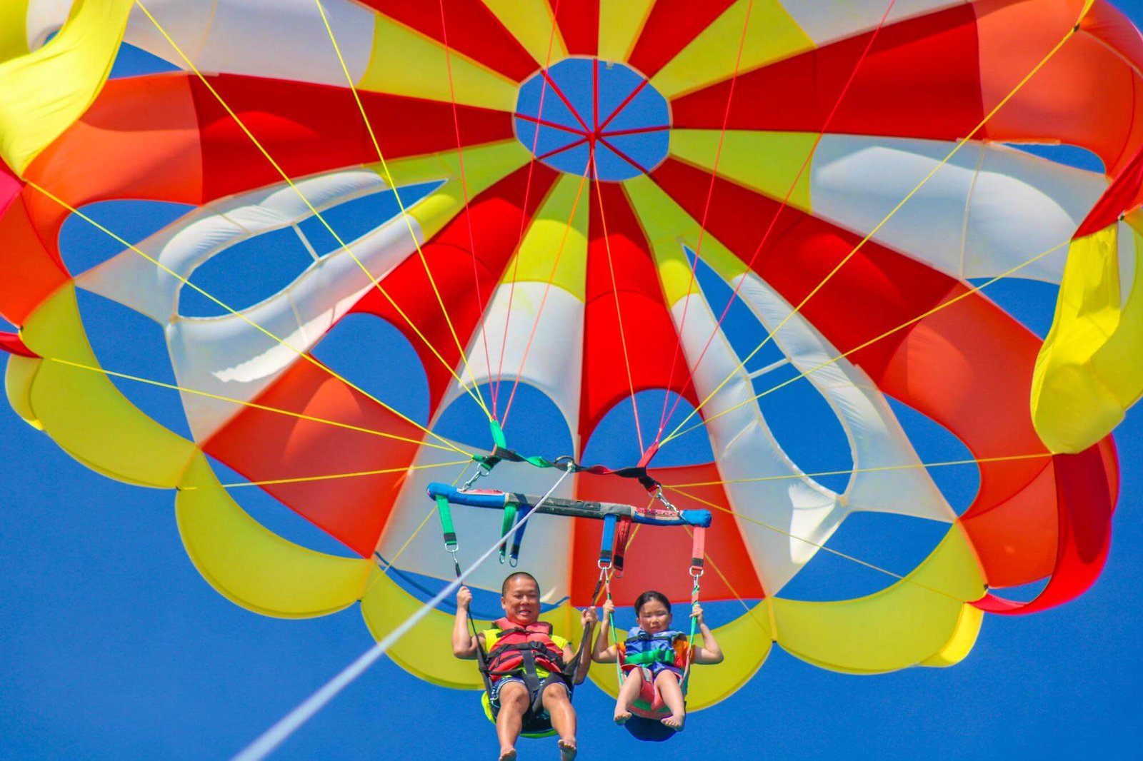 Parasailing high above the turquoise water of Palm Beach, Aruba