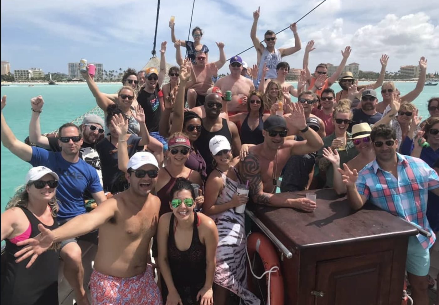 Guests cheering on deck during the Flagship Aruba afternoon sail