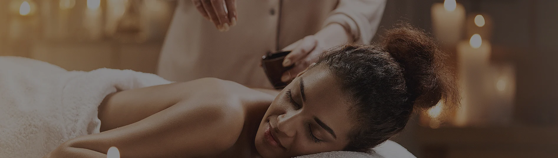 Guest receiving a head massage at their rental in Aruba
