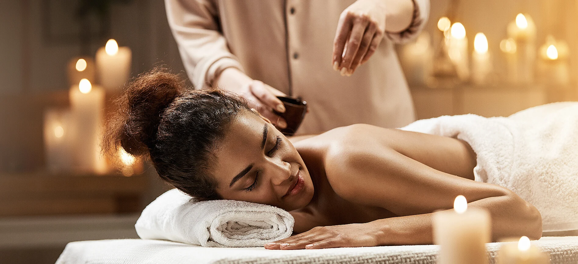 The Good Aura signature massage set up by candlelight in Aruba