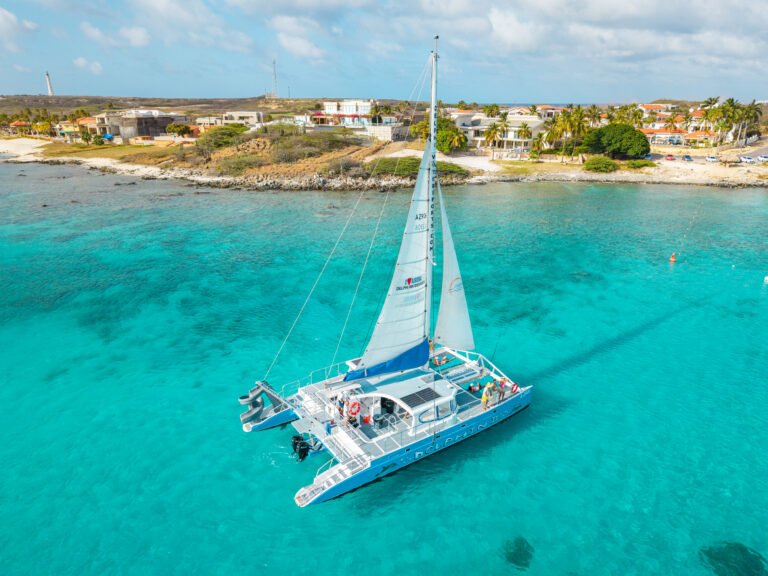 Catamaran snorkel cruise anchored in clear water in Aruba
