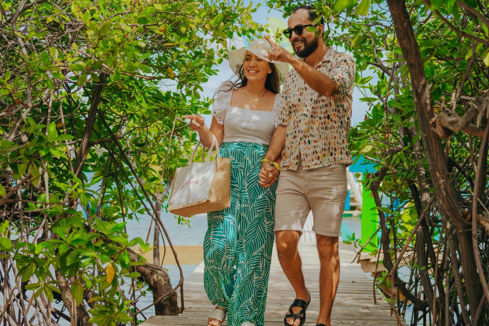 Couple walking through mangroves on a private island in Aruba